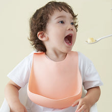 Load image into Gallery viewer, Fashionable silicon Breastplate Baby Bib Waterproof Solid Infant
